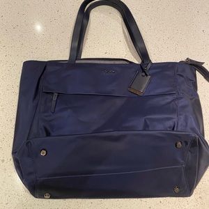 Tumi Nylon Travel Tote with padding for laptops.